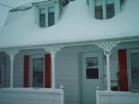Maison sous la neige
